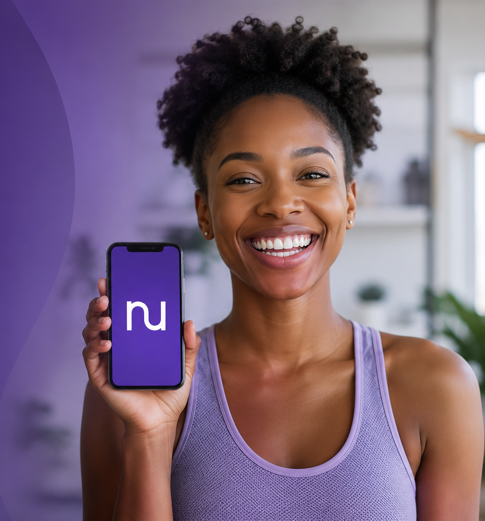 A NuHealth member holding a phone with the nu app